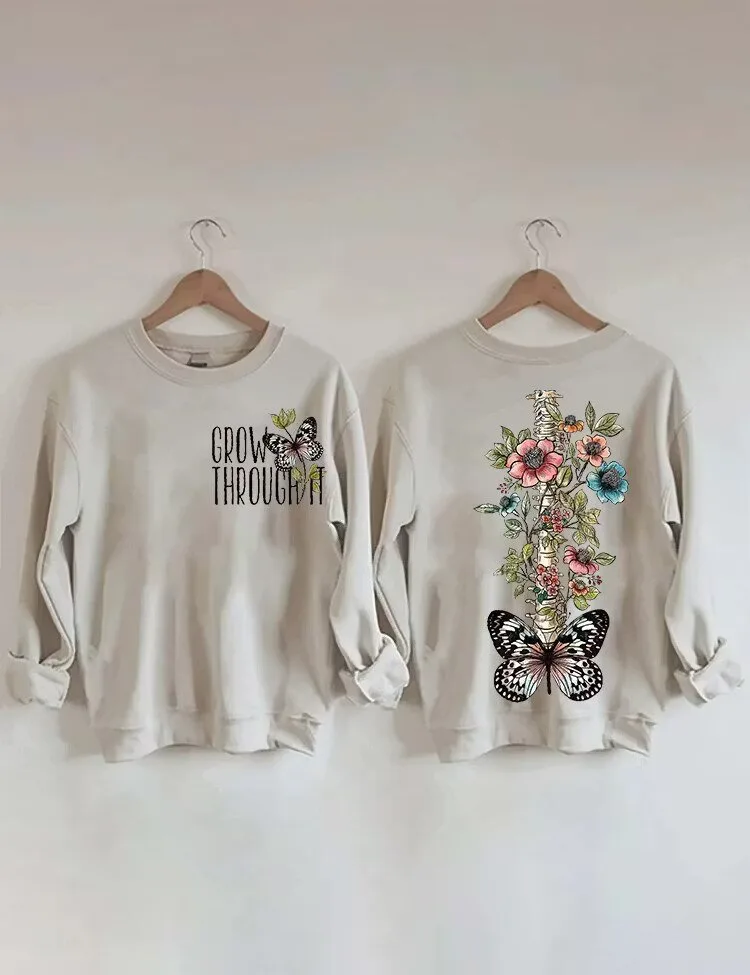 Grow Through It Butterfly Floral Spine Skeleton Crewneck Sweatshirt